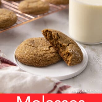 Pinterest graphic of a broken and whole molasses cookie on a white plate.