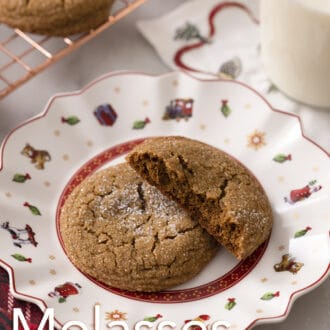 Pinterest graphic of a molasses cookie on a holiday plate with a half cookie stacked on top.
