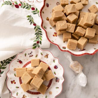 Peanut butter fudge pieces sitting on a christmas plate