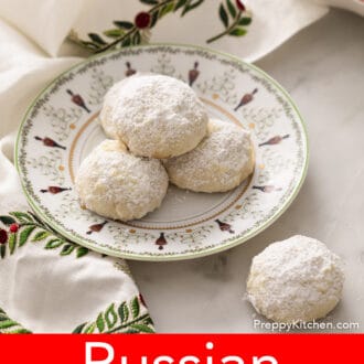 russian tea cakes on a plate decorated with a christmas scene