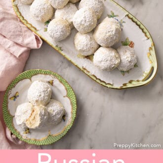 russian tea cakes on a tray on a white marble counter