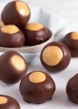 close up of buckeyes on a white surface