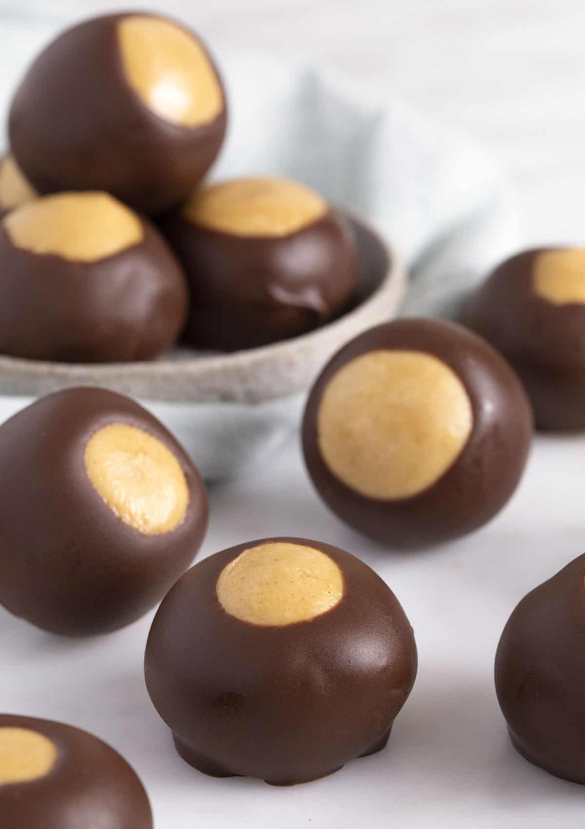 close up of buckeyes on a white surface