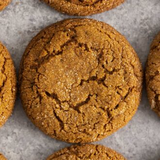 Molasses cookies on a gray surface.