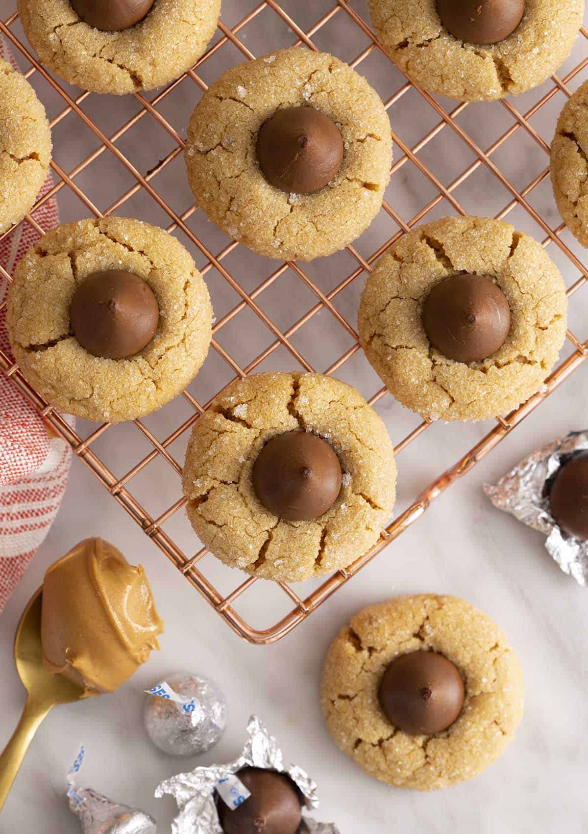 peanut butter blossoms on a copper wire cooling rack