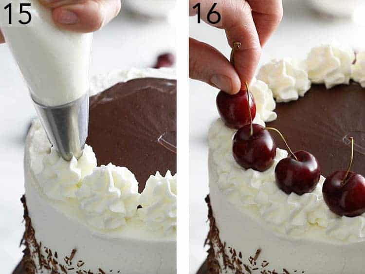 Dollops of whipped cream and cherries being placed on a black forest cake.