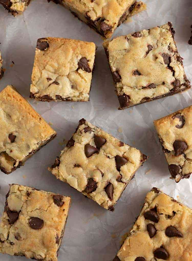 Chocolate Chip Cookie Bars on white parchment paper.