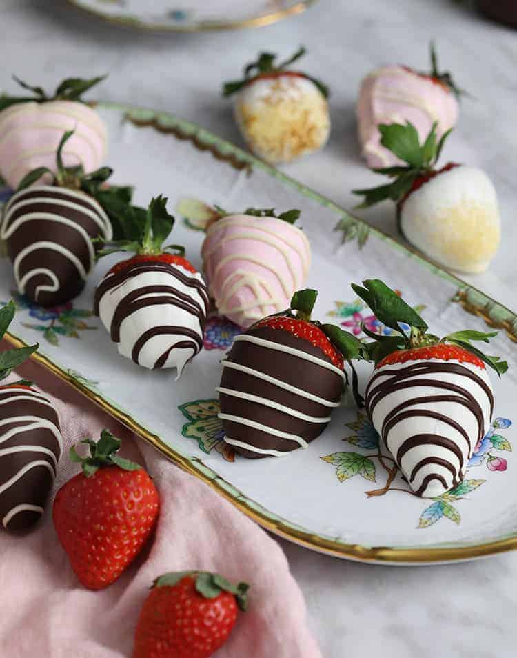 Strawberries covered in chocolate with striped patterns