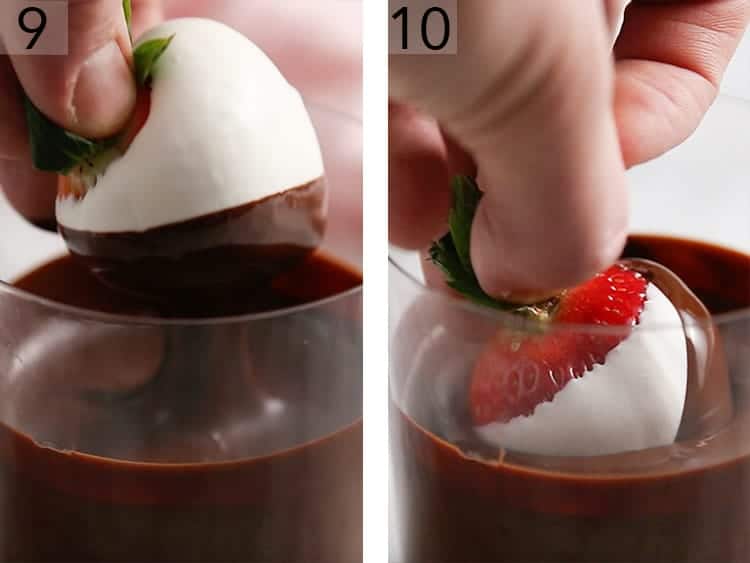 A tuxedo strawberry getting dipped in chocolate.
