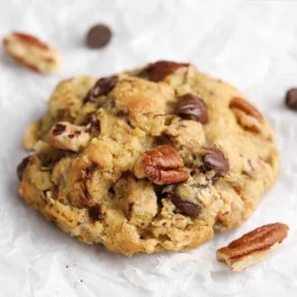 A cowboy cookie with pecans, chocolate chips, oats and shredded coconut.