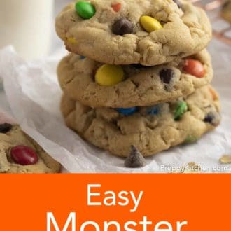 stacked monster cookies on parchment