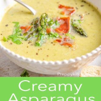 asparagus soup in a white bowl with a spoon