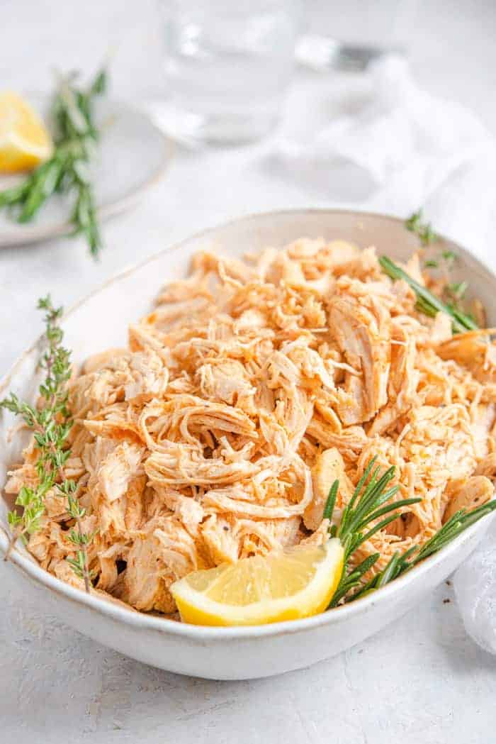 A close up of Instant Pot Shredded Chicken in a serving bowl