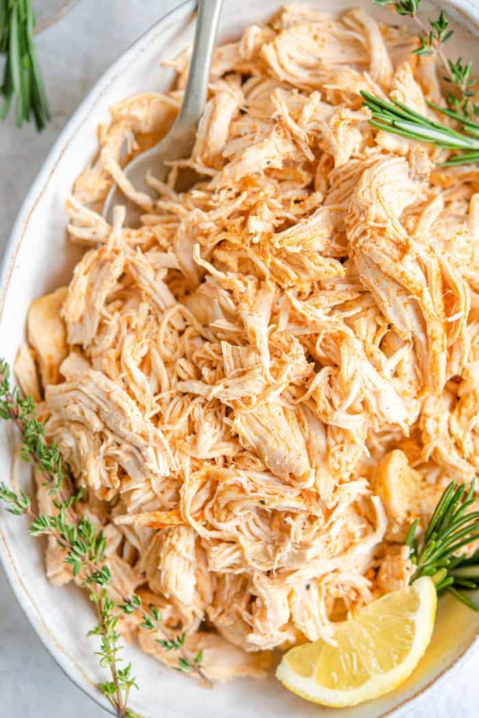 A close up of shredded chicken in a bowl