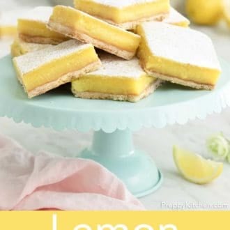 lemon bars stacked on a stand