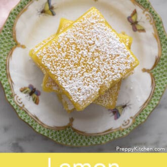 lemon bars stacked on a plate
