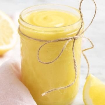 Lemon curd in a glass mason jar.