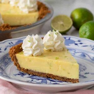 Close-up of a slice of pie on a blue and white plate.