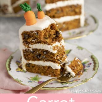 Pieces of carrot cake on porcelain plates, one of them is partially eaten.