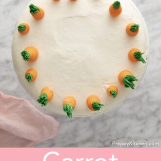 A top-down view of a carrot cake with buttercream carrots on top.