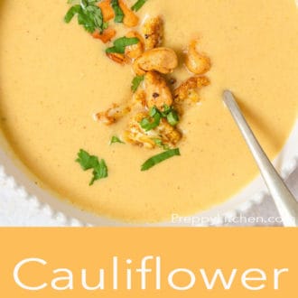 cauliflower soup in a white bowl with a spoon