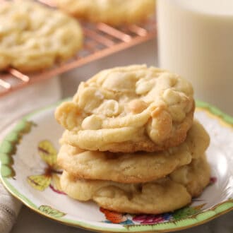 Delicious white chocolate chip macadamia nut cookies on a porcelain plate.