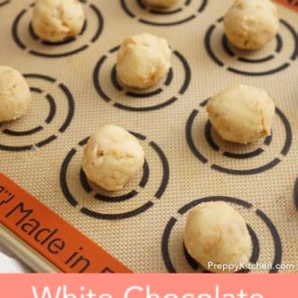 rolled white chocolate macadamia cookie dough on a silpat
