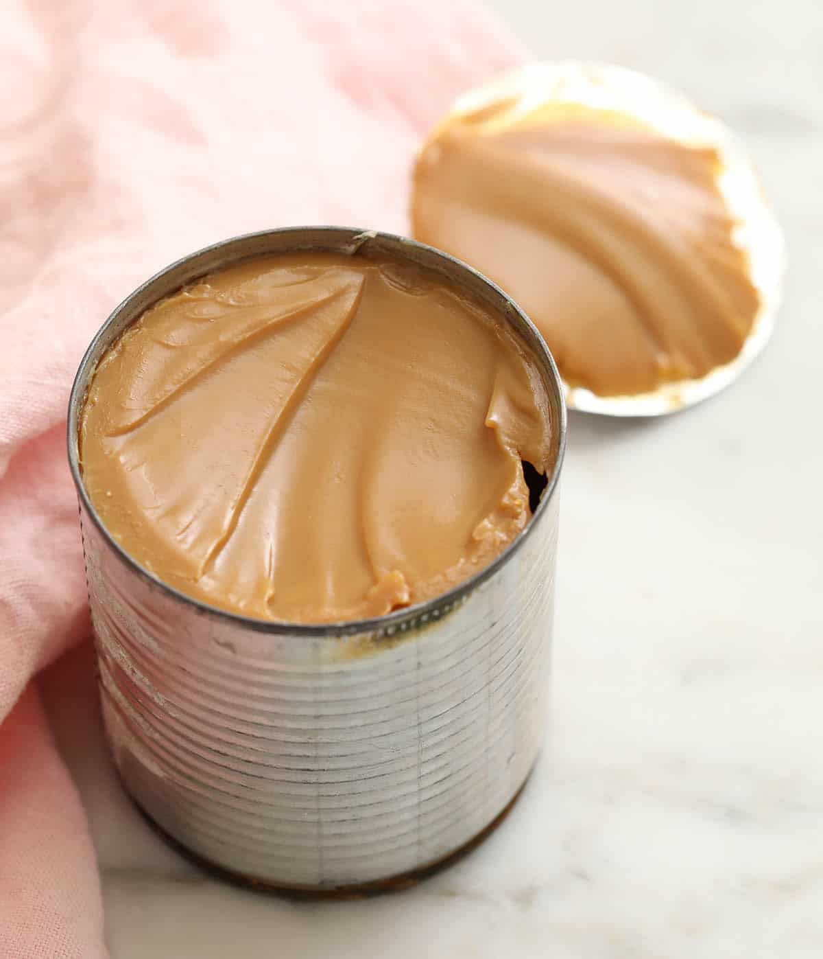 Freshly cooked dulce de leche in a can.