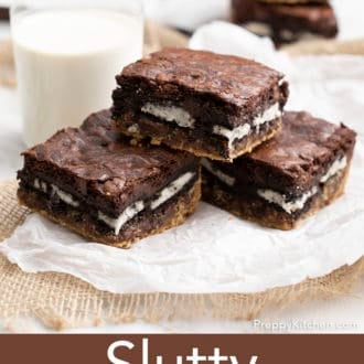 slutty brownies stacked on parchment paper