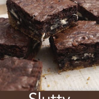 slutty brownies stacked on parchment paper