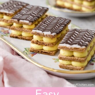 Four Mille Feuilles on a serving tray.
