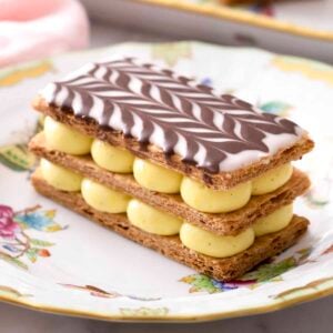 A delicious Mille Feuille topped with a chocolate chevron pattern.