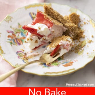 Piece of no bake strawberry cheesecake on a plate with fork