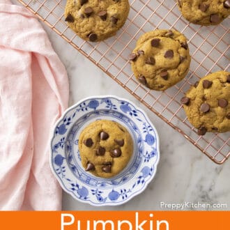 A Pumpkin chocolate chip cookie on a blue and white plate.