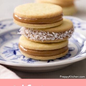 Three alfajores on a plate, the middle one has been rolled in coconut.