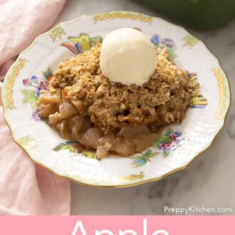 Pinterest graphic of a plate of apple crisp with oats and cinnamon topped with ice cream.