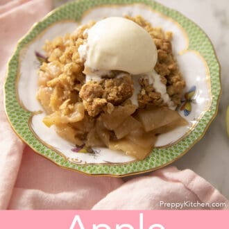 Apple crisp topped with melting ice cream.
