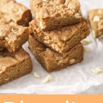 Pinterest graphic of multiple blondies stacked on parchment paper.