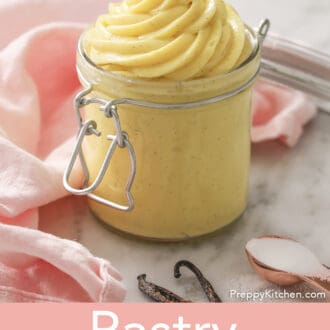 A big swirl of pastry cream peaking out of a jar.