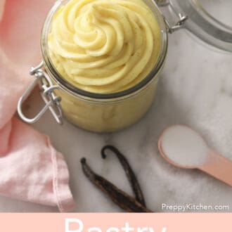 A jar of Pastry cream on a marble counter.