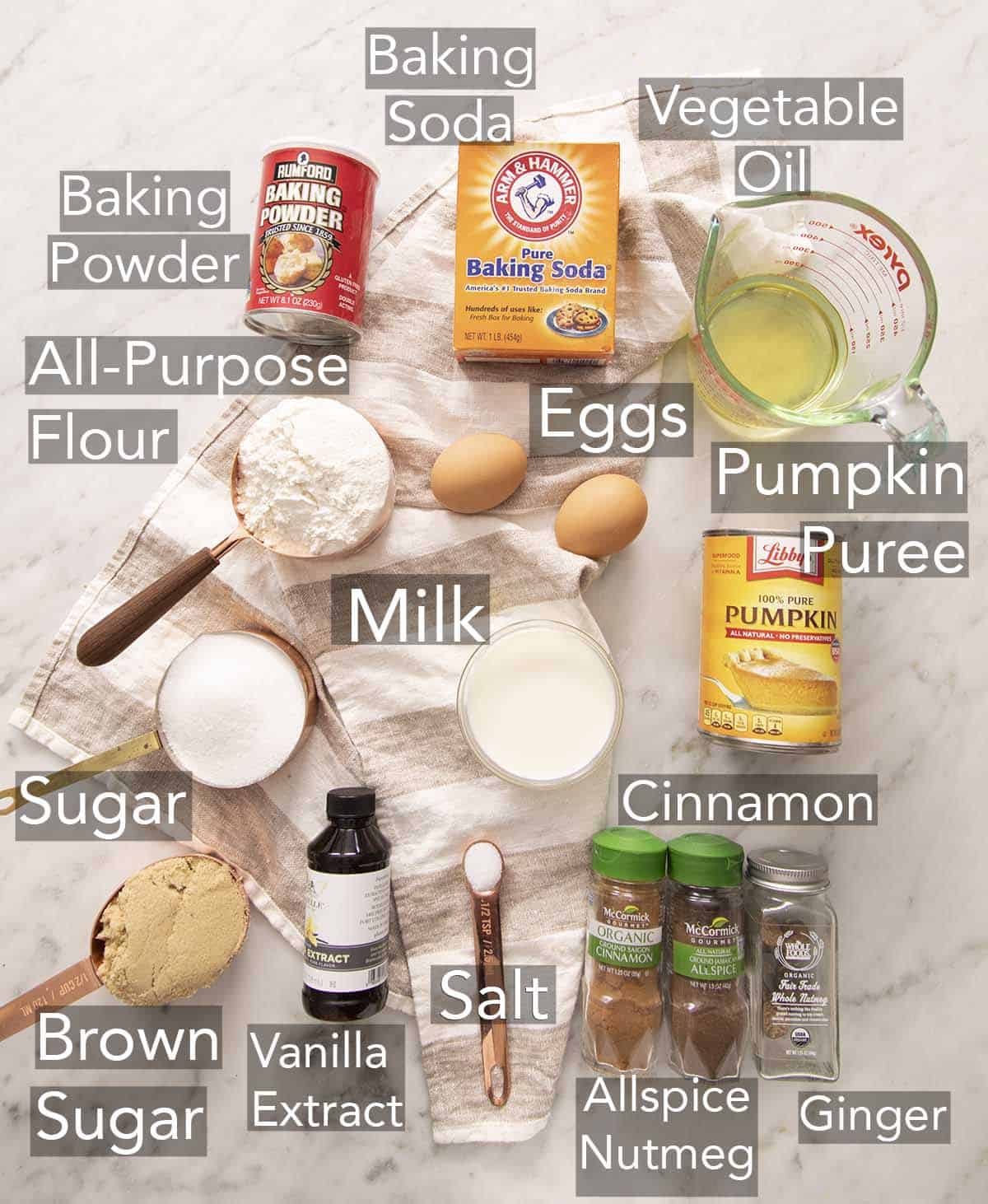 Ingredients for making pumpkin bread on a counter.