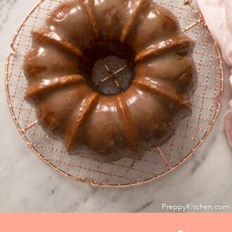 A bundt shaped rum cake covered in rum sauce.