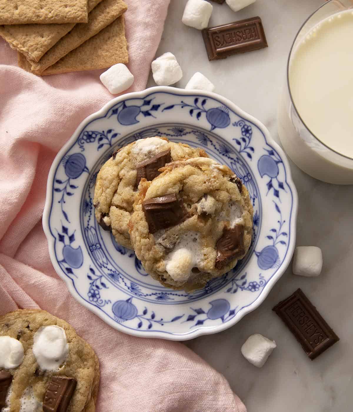 Two Smores Cookies on a blue and white plate.