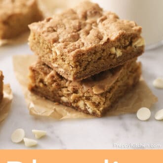 Pinterest graphic of two white chocolate chip blondies next to a glass of milk.