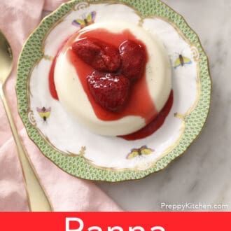 A top-down photo of a panna cotta with strawberries.