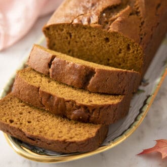 A loaf of pumpkin bread that has been sliced.