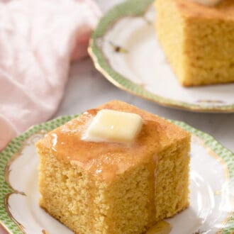 Pinterest graphic of two pieces of cornbread with butter and honey.