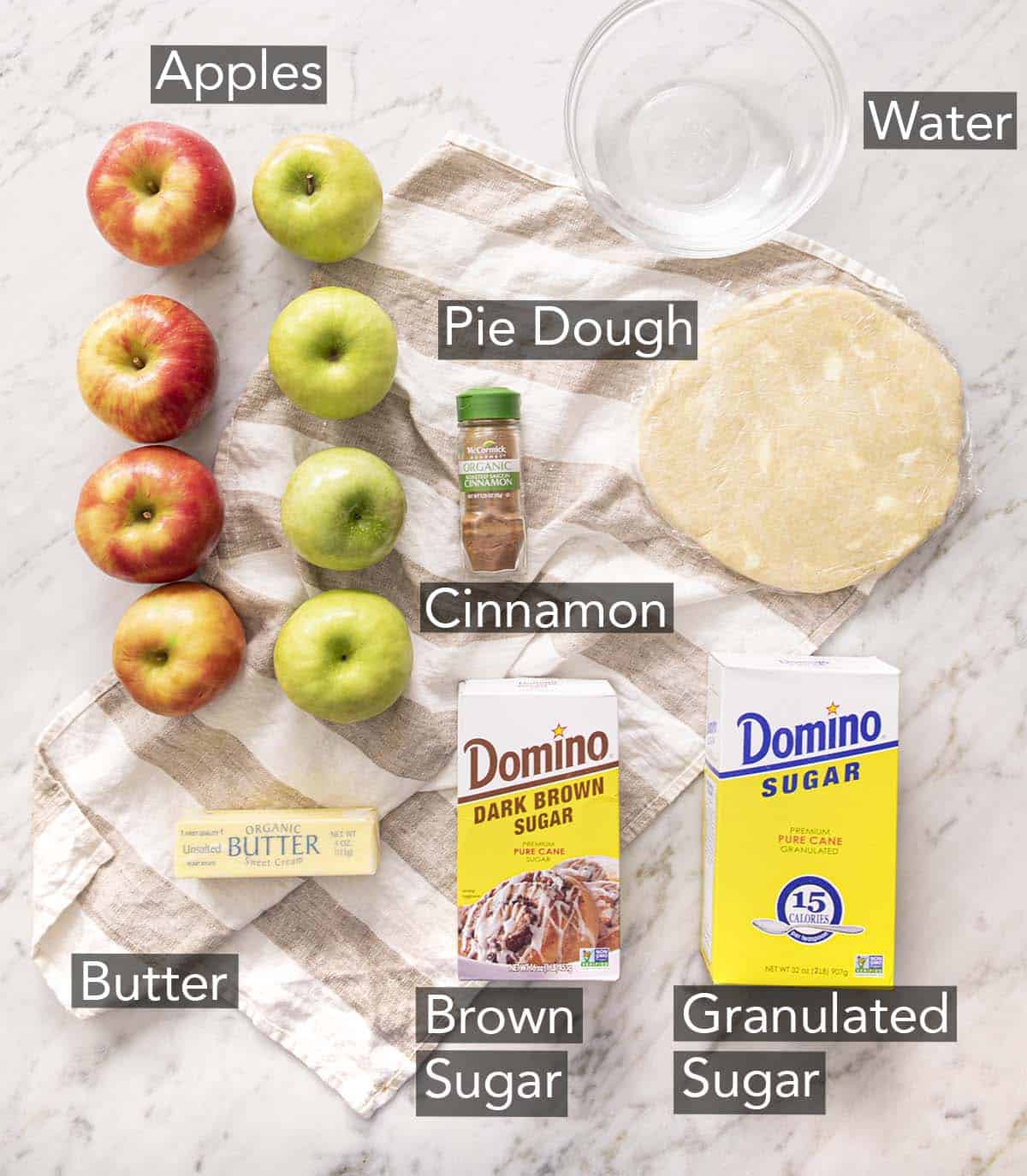 Ingredients for making apple dumplings on a counter.