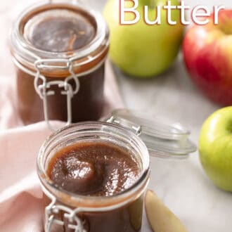 Two glass containers of apple butter on a counter.