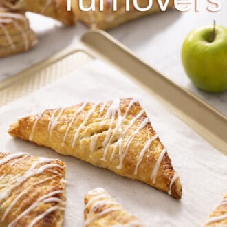 Pinterest graphic of apple turnovers on a golden baking sheet.